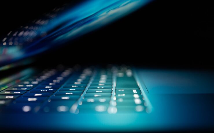 closeup photo of turned-on blue and white laptop computer security safety